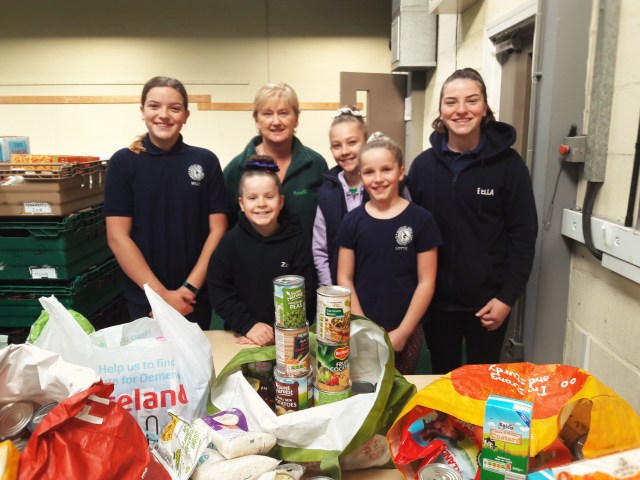 Girls drop off food at Flintshire Foodbank